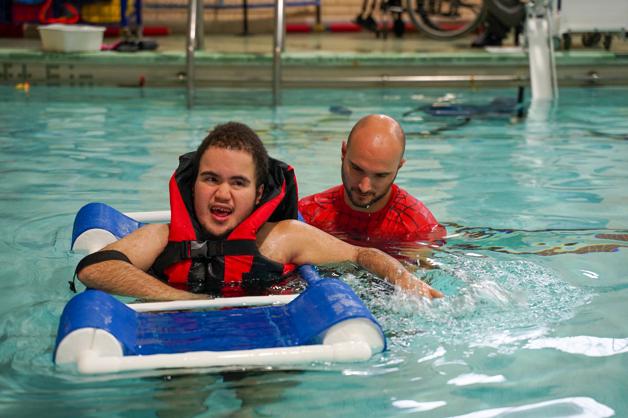 Student with teacher in pool at Pathfinder School